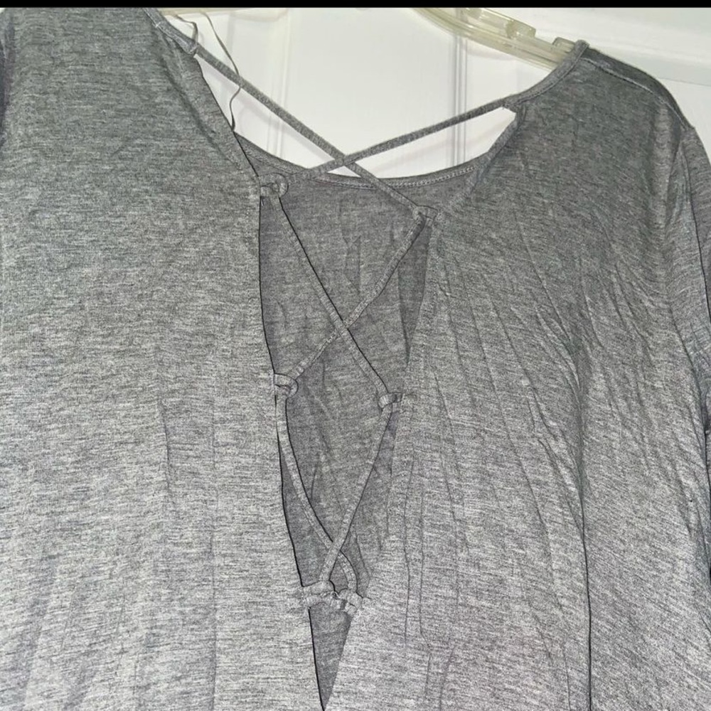 gray blouse with crossed design in the back
